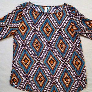 Brightly colored patterned blouse